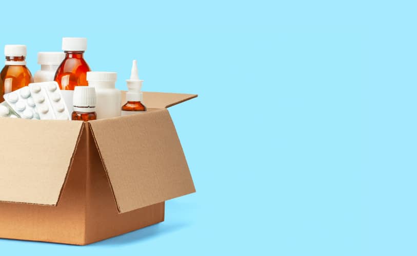 Medication bottles prepared in a shipping box